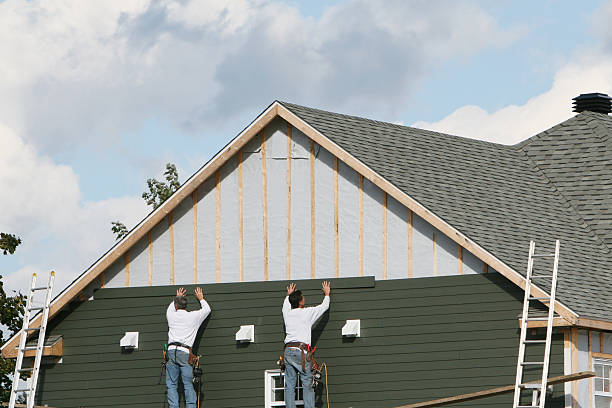 Professional Vinyl Siding technician working in West Babylon, NY